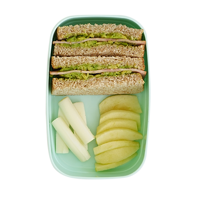 Turkey Avocado sandwich with mozzarella sticks and sliced apples