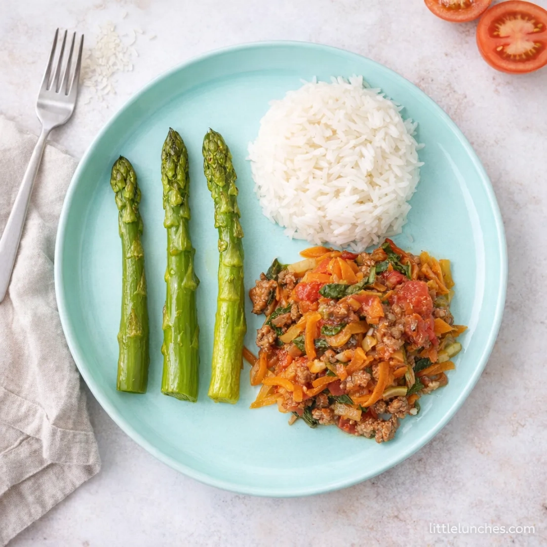 Bolognese with a side of rice and asparagus